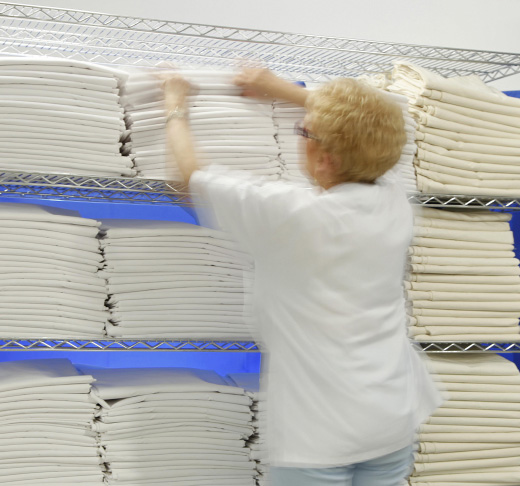 person stacking sheets